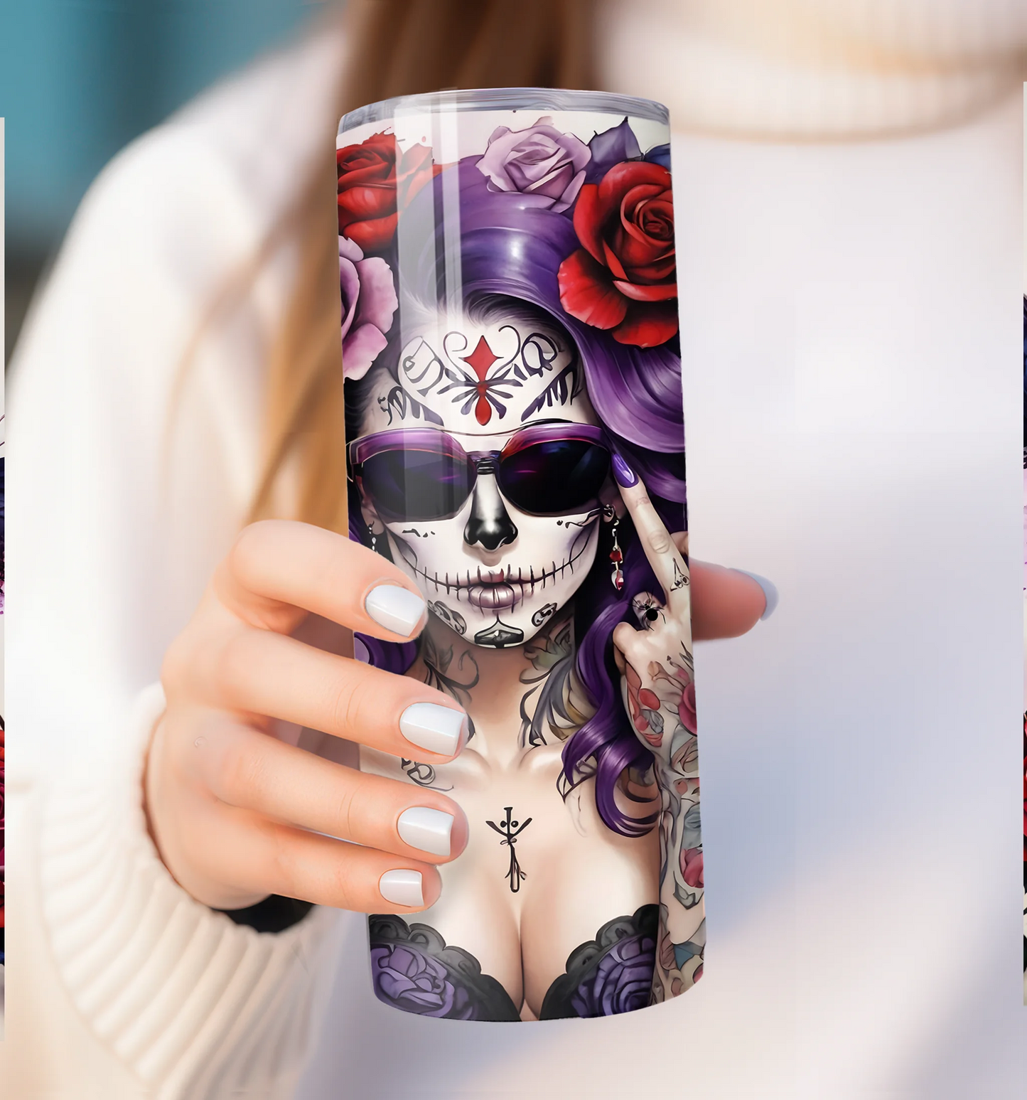 Tumbler with a colorful skull design held by a person