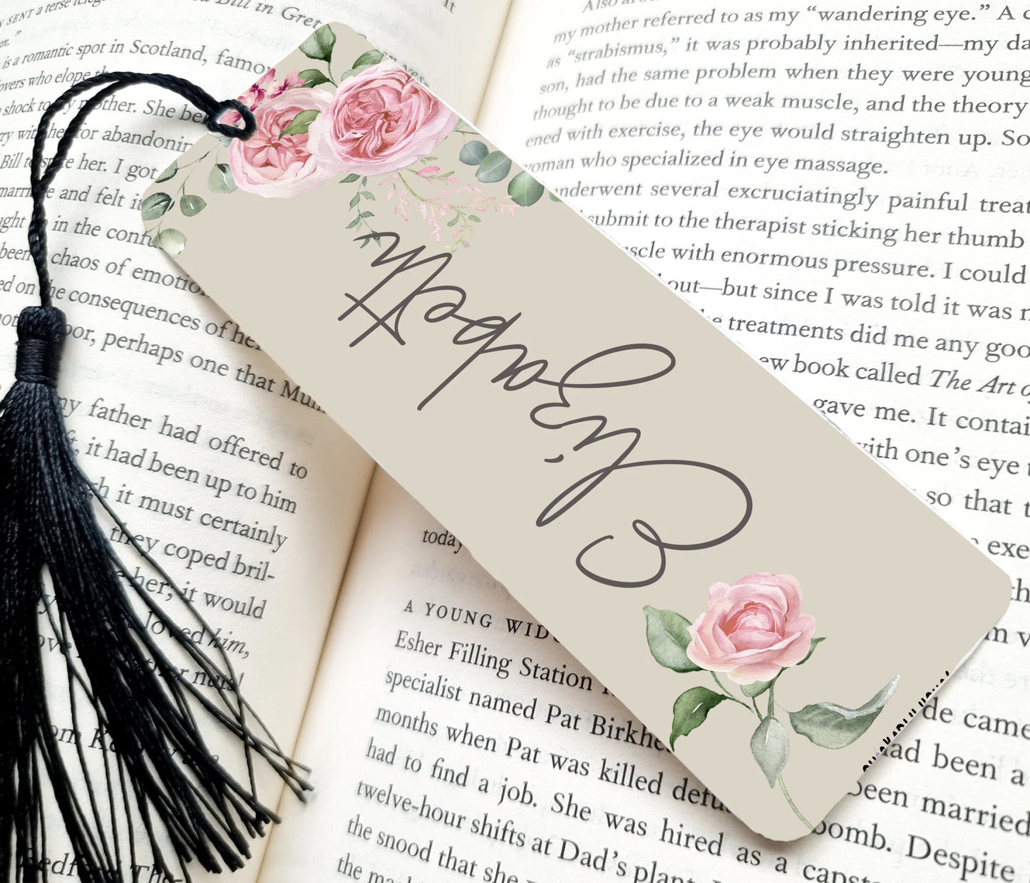 Decorative bookmark with floral design on an open book
