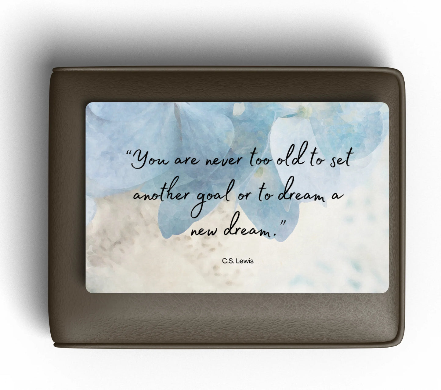 Wallet card with floral design and motivational quote on a white background