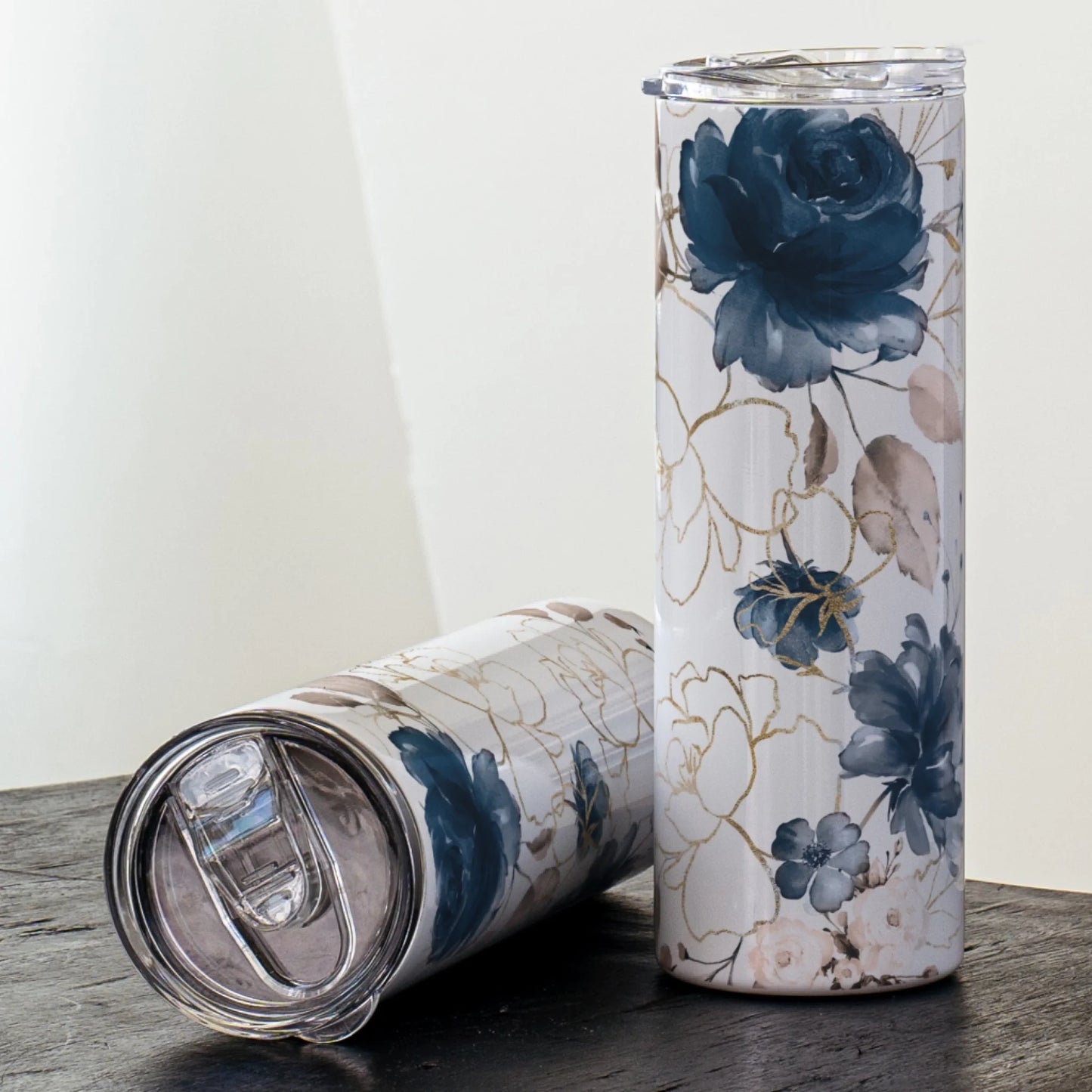 blue floral tumbler with white and gold accents