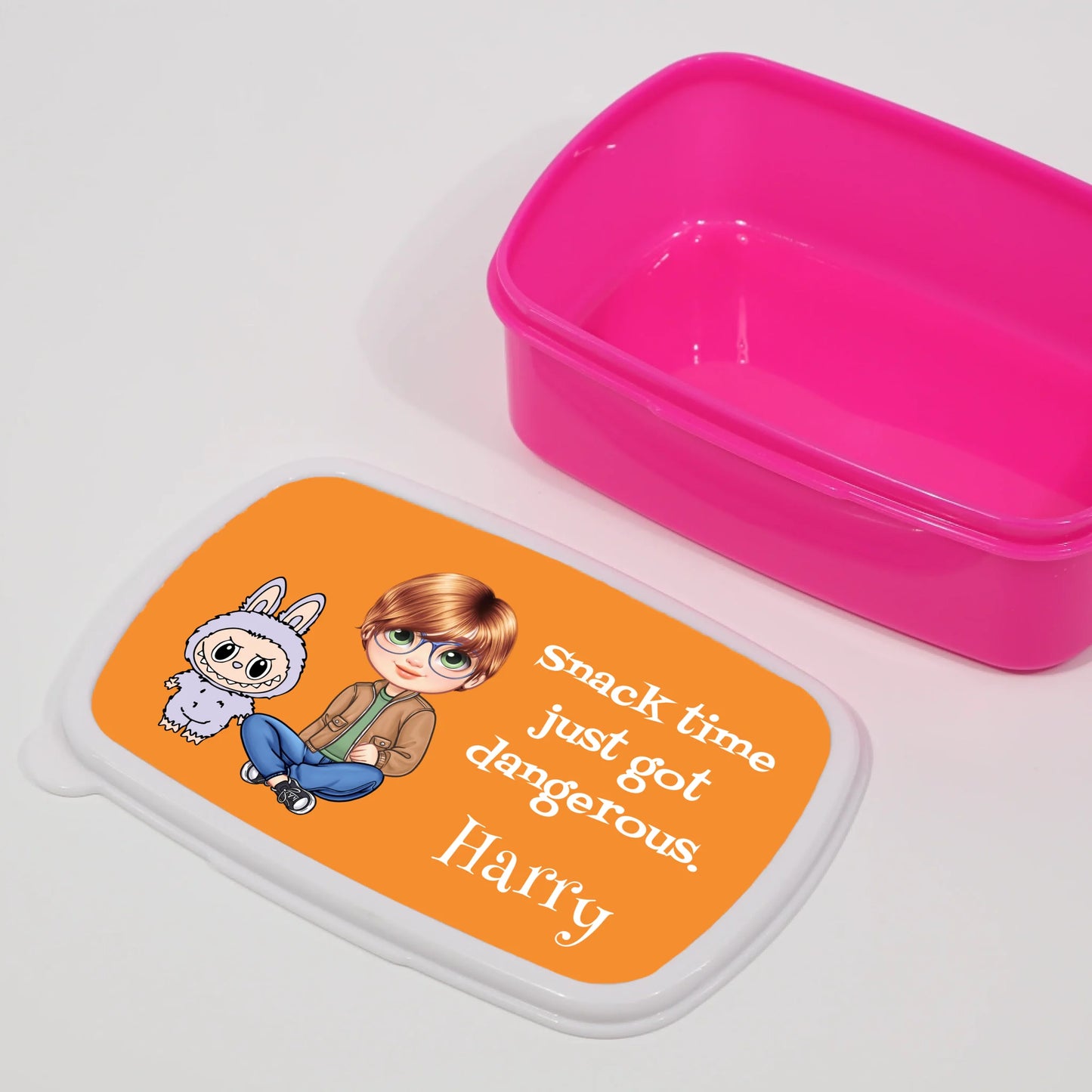 pink lunchbox with labubu character