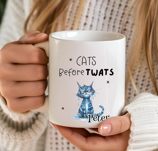 Person holding a mug with a cat-themed design and text. funny-cat-mug-gift