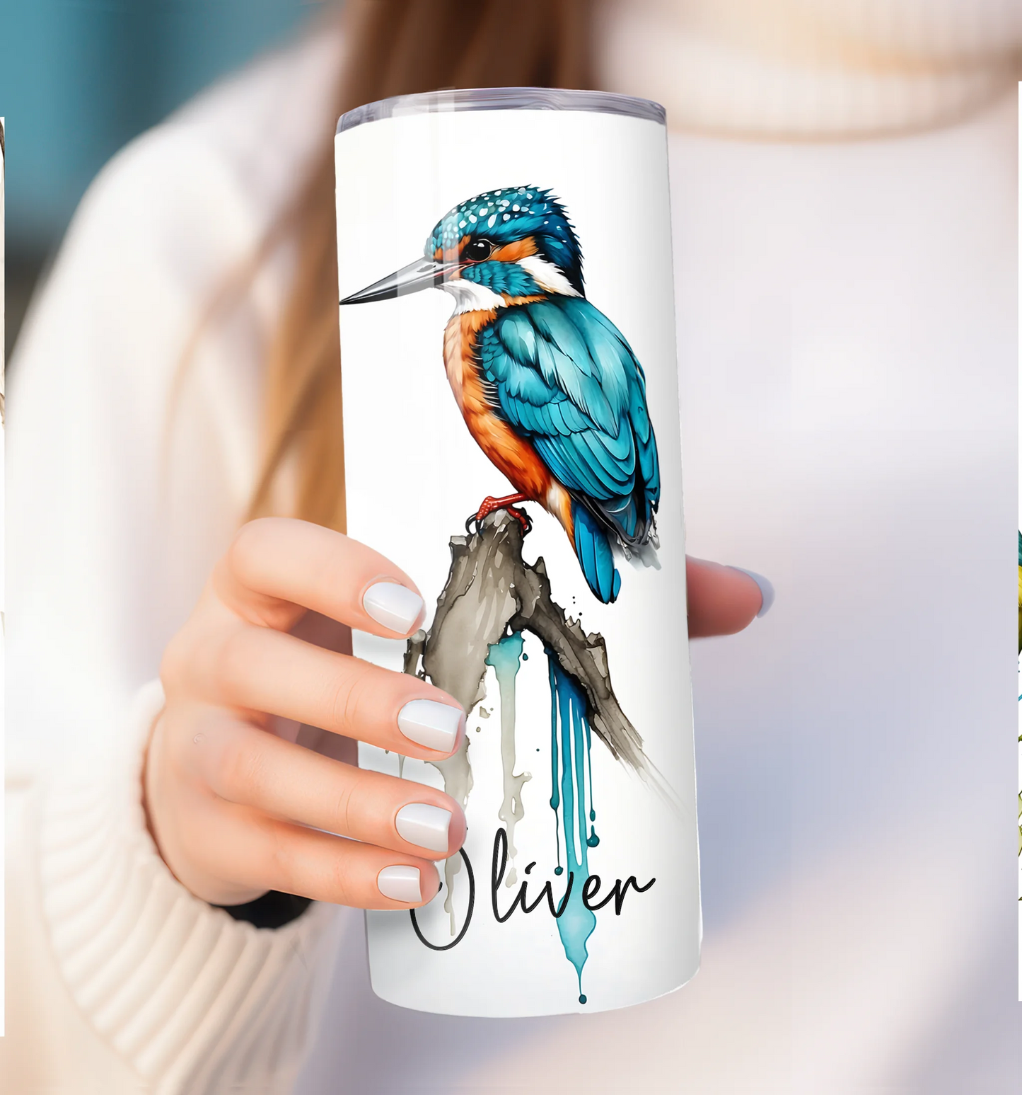 Tumbler with a kingfisher design and the name 'Oliver' held by a person.