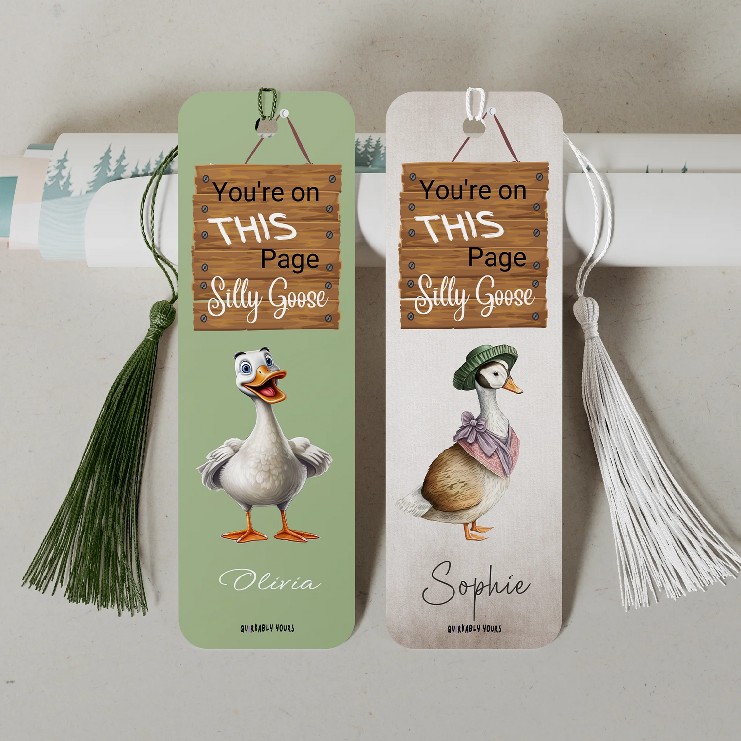 Two bookmarks with cartoon ducks and humorous text on a neutral background