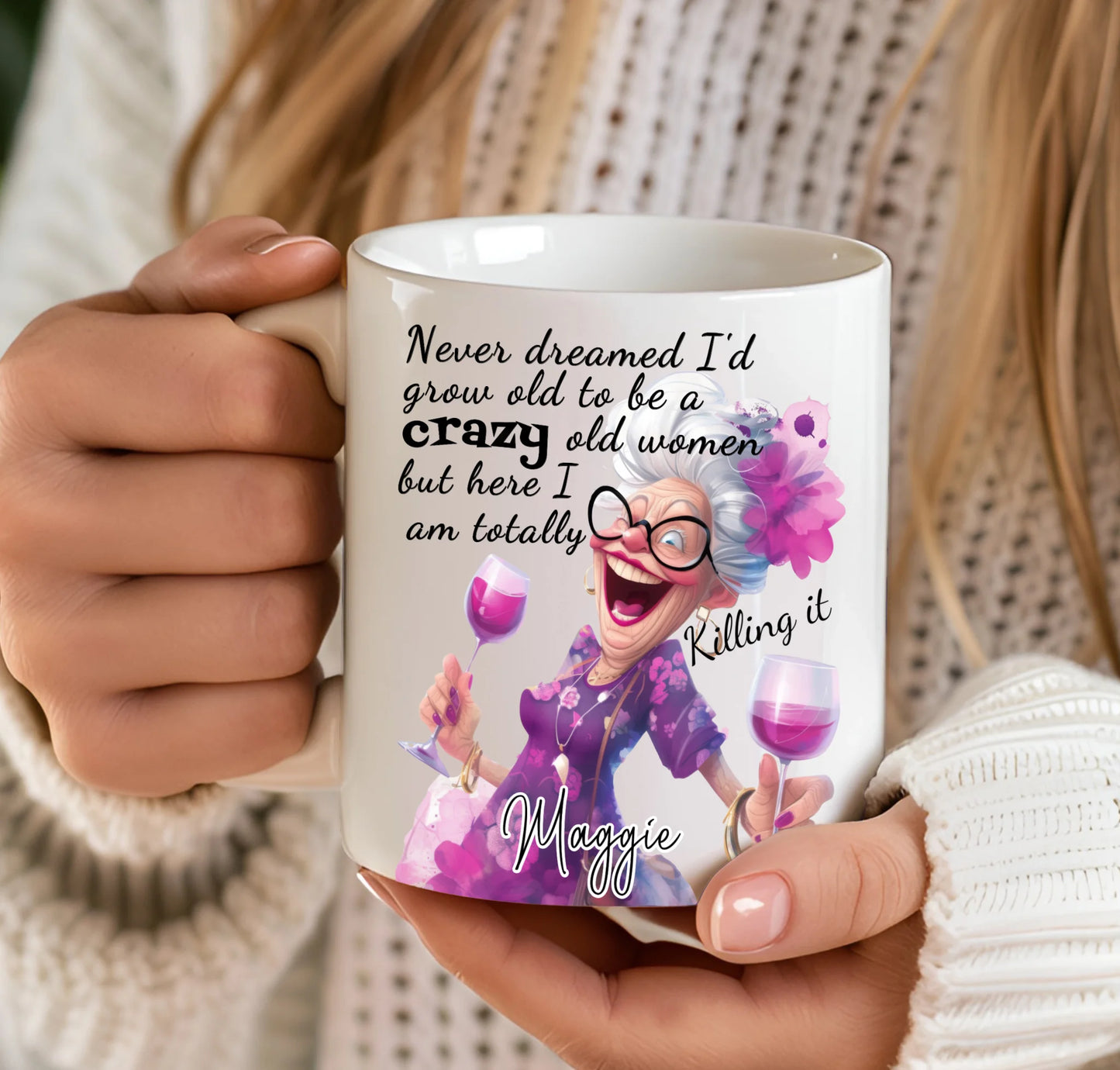 Mug with a design of an older woman with purple hair and glasses, holding a glass of wine, with text on it.
