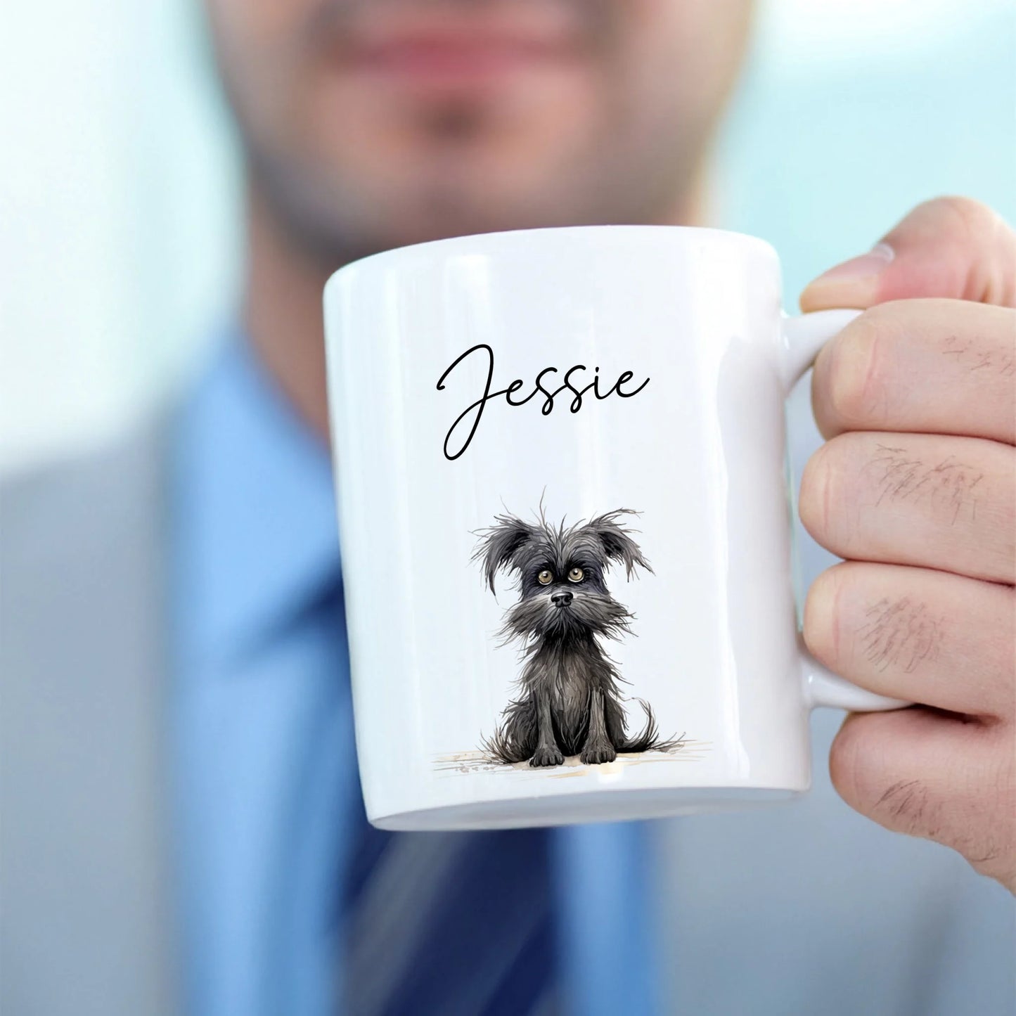 A man holding a personalised mug for the gift sets