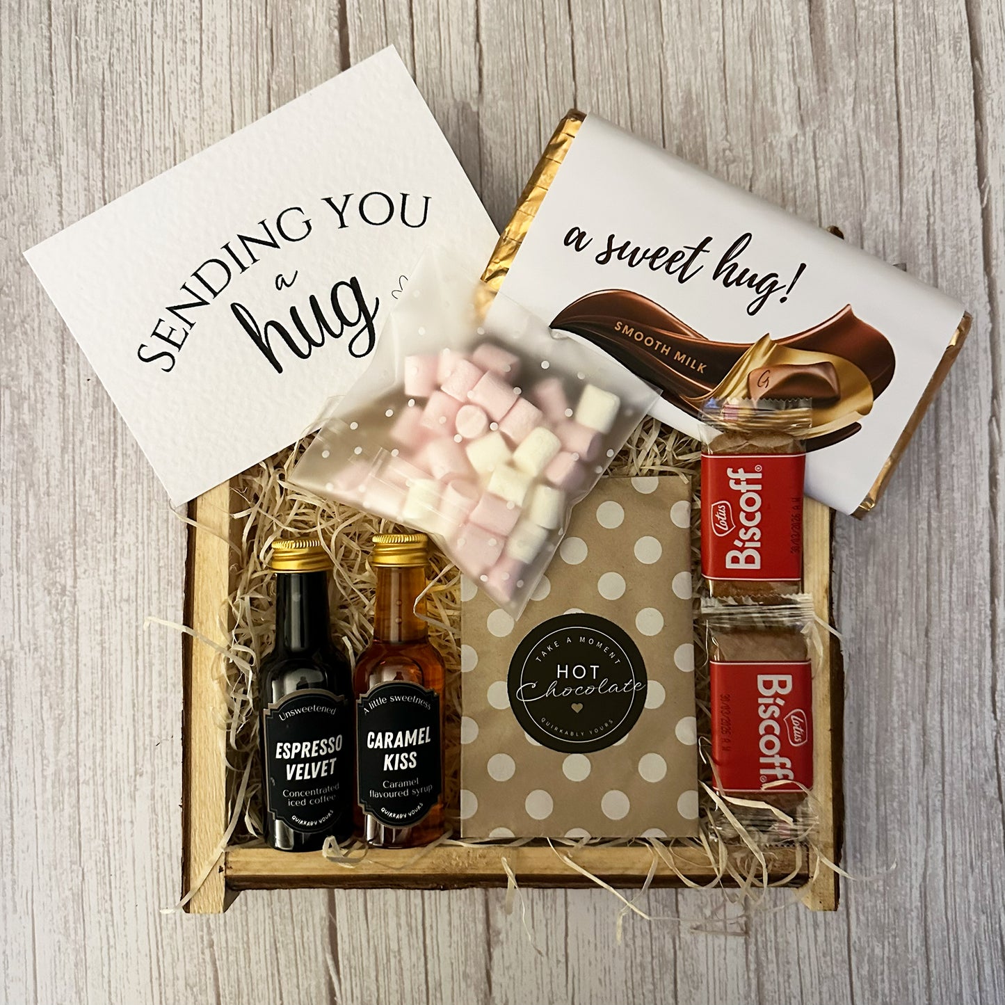 Gift set with hot chocolate, marshmallows, and small bottles coffee and syrup add on to mugs and tumbler gift sets