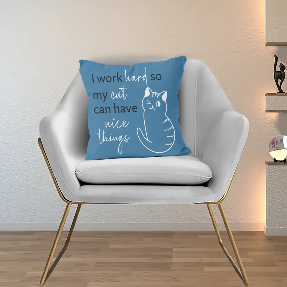 blue cushion with cat and quote