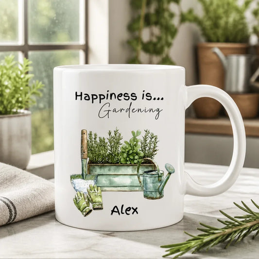 White mug with gardening-themed design and text 'Happiness is... Gardening - Perfect gift for gardeners