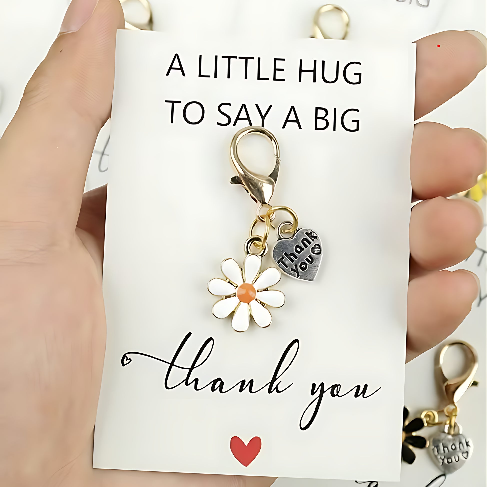 Part of thank you letterbox gift - Keychain with floral and heart charm on a card with 'thank you' message