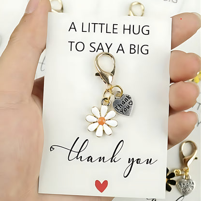 Part of thank you letterbox gift - Keychain with floral and heart charm on a card with 'thank you' message