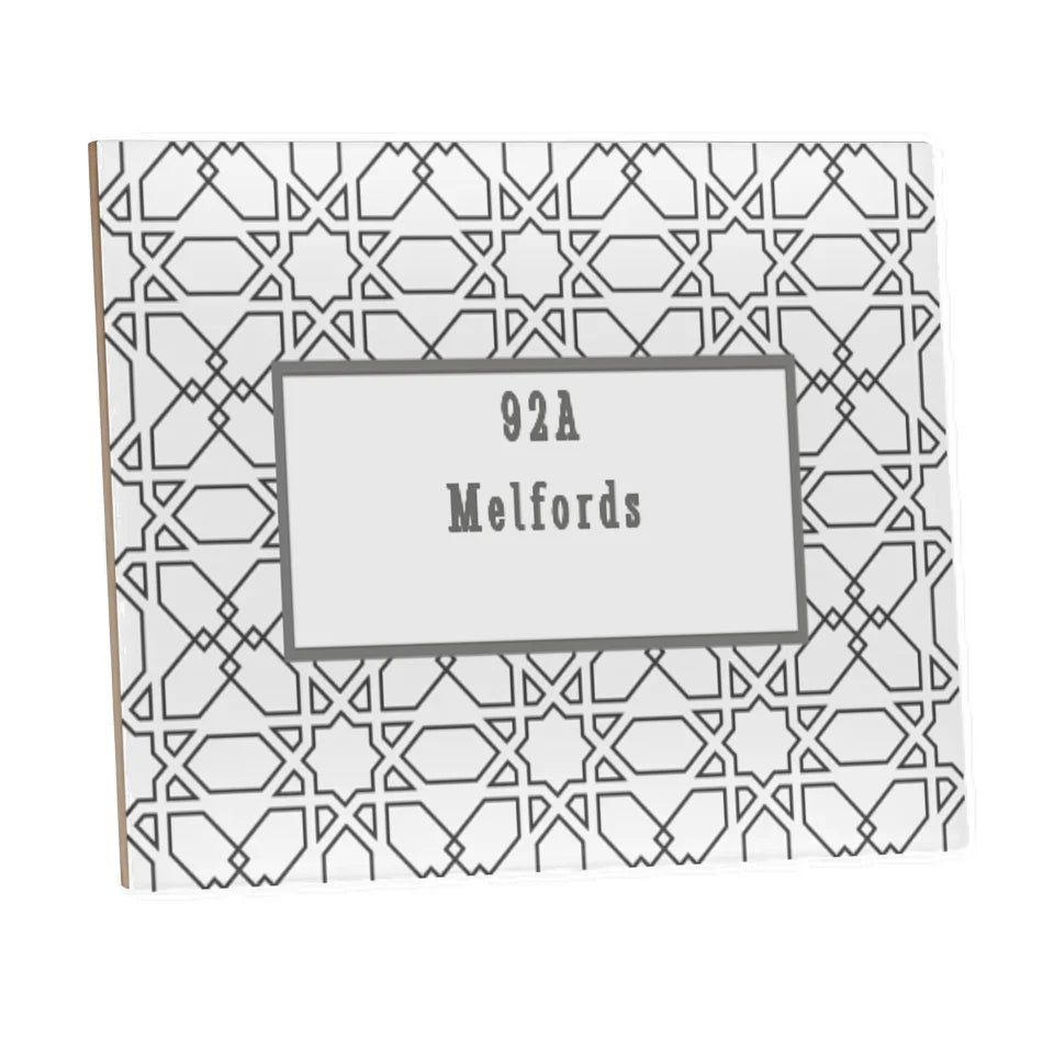 House name ceramic tile with black and white design