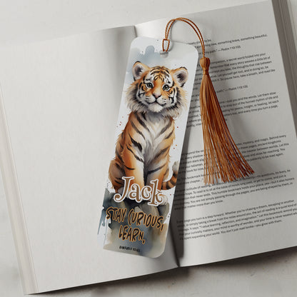 Bookmark with a tiger design on an open book with a motivational quote
