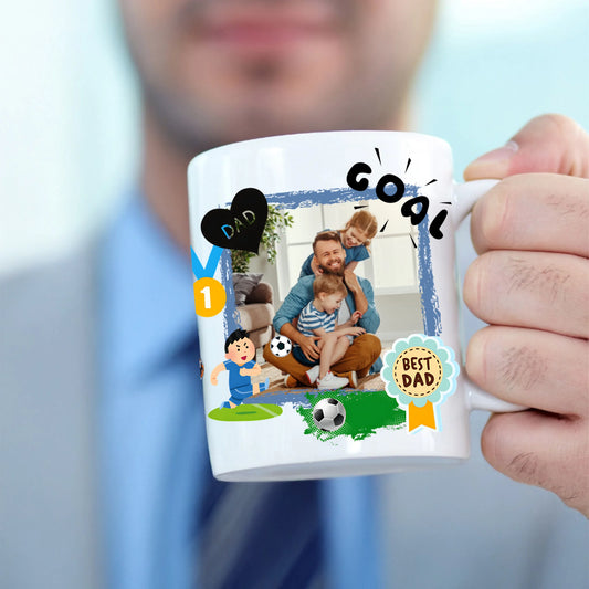 Person holding a mug with personalized designs and text, including a photo of a father and child playing soccer.