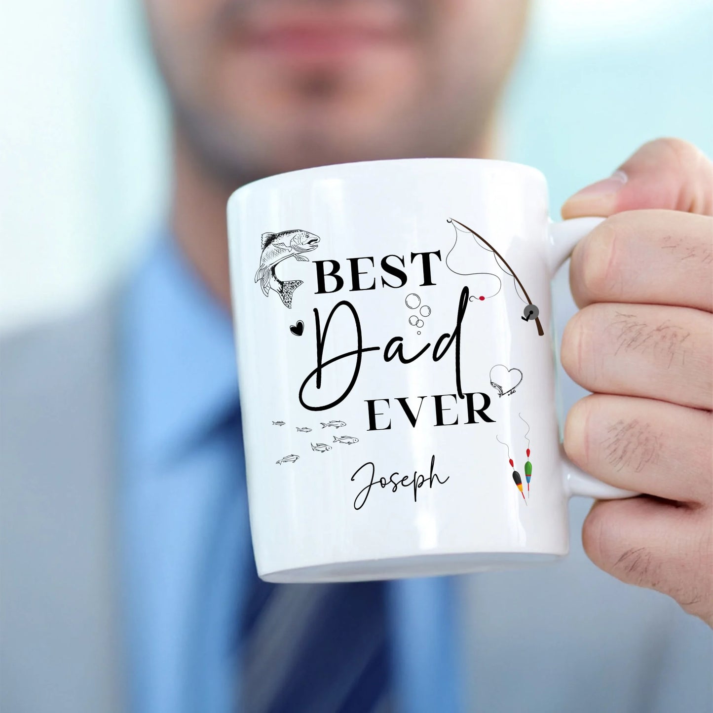 Best Ever Fishing Dad personalised mug in mans hand