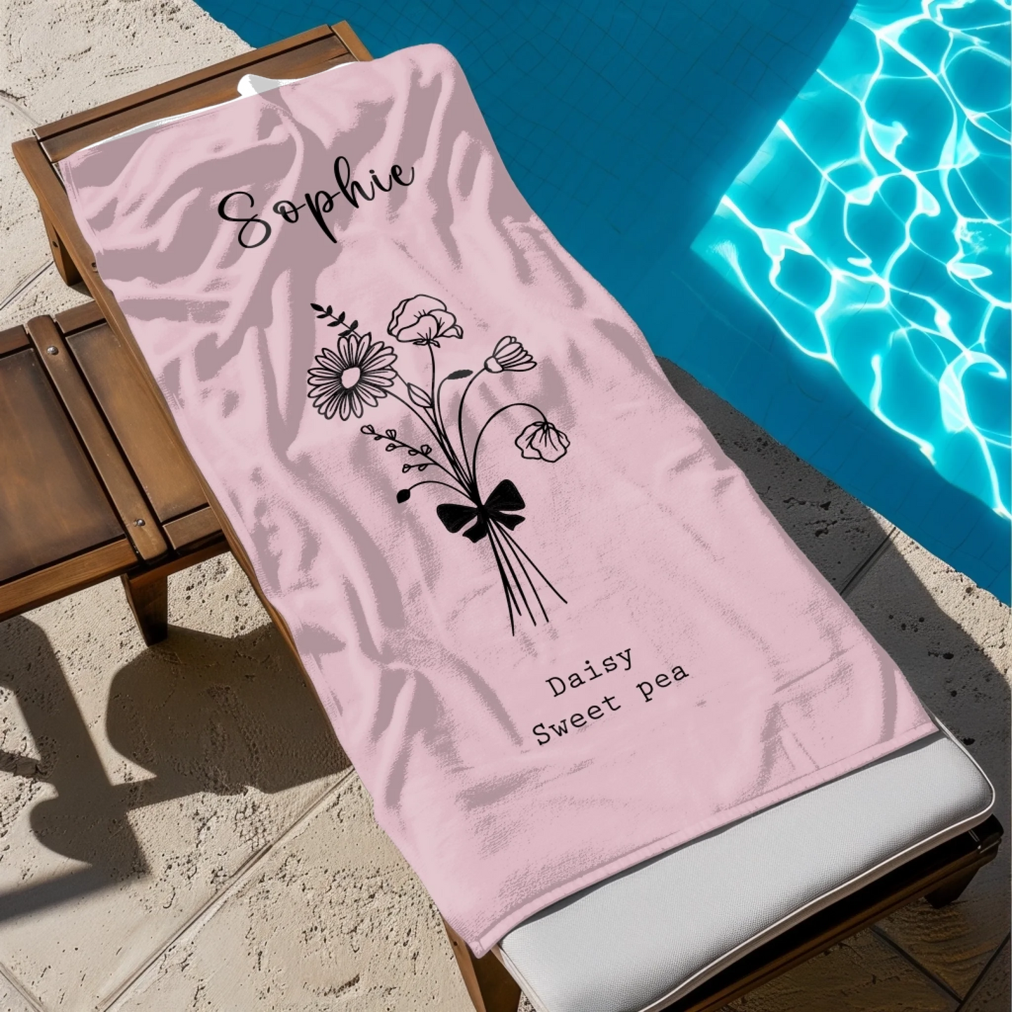 Close-up of hand-drawn birth flower design on beach towel for adults