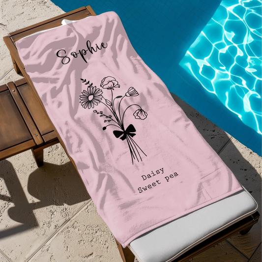 Close-up of hand-drawn birth flower design on beach towel for adults