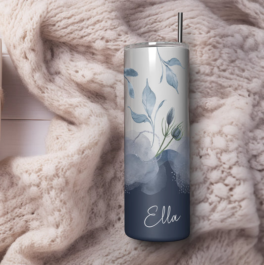 Tumbler with floral design and 'Ella' branding on a soft pink blanket