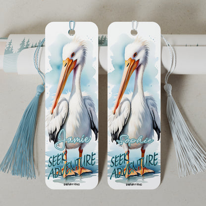 Two bookmarks with pelican illustrations and personalized names on a light grey background with an inspirational quote