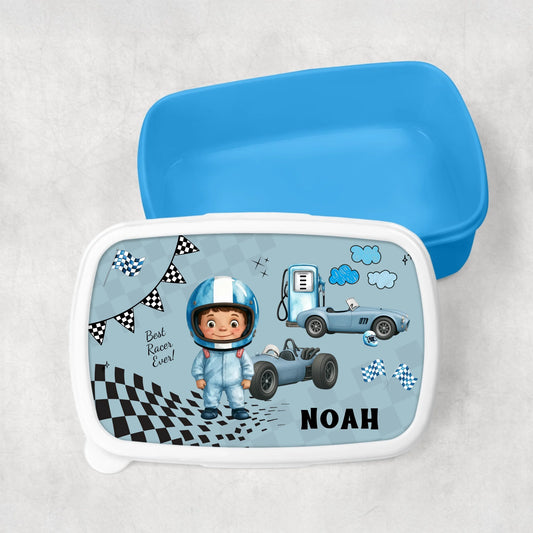 Children's lunch box with racing theme and name  on a light grey background