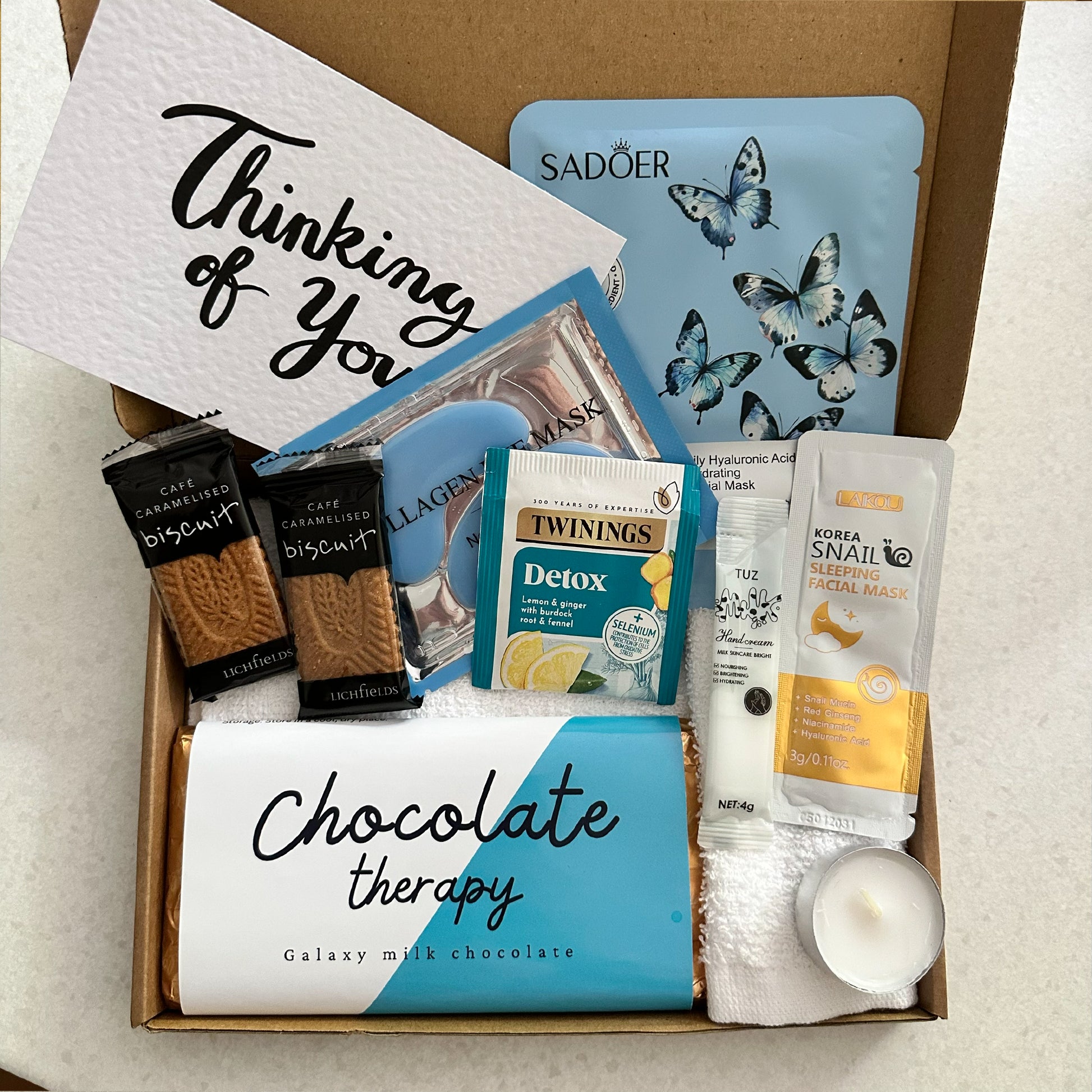 Pick me up present with chocolate treats and pamper items