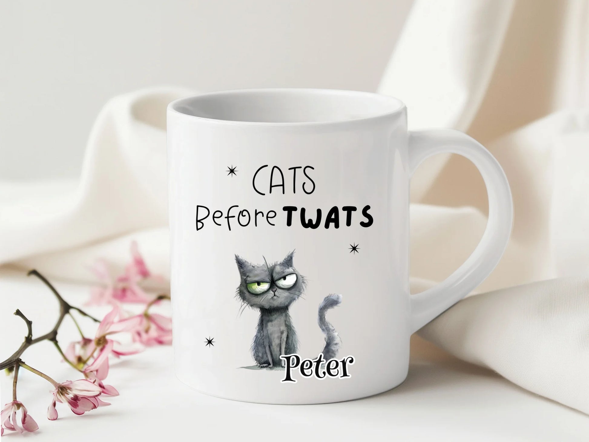 White mug with a cat illustration and text on a light background Customisable cat mug