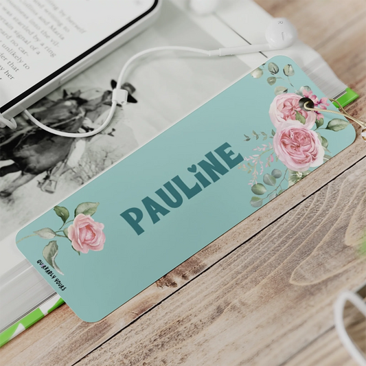 Custom name bookmark with soft pink flowers and green leaves.
