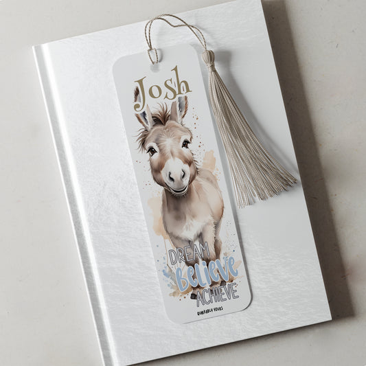 Bookmark with a donkey illustration and motivational text on a white surface
