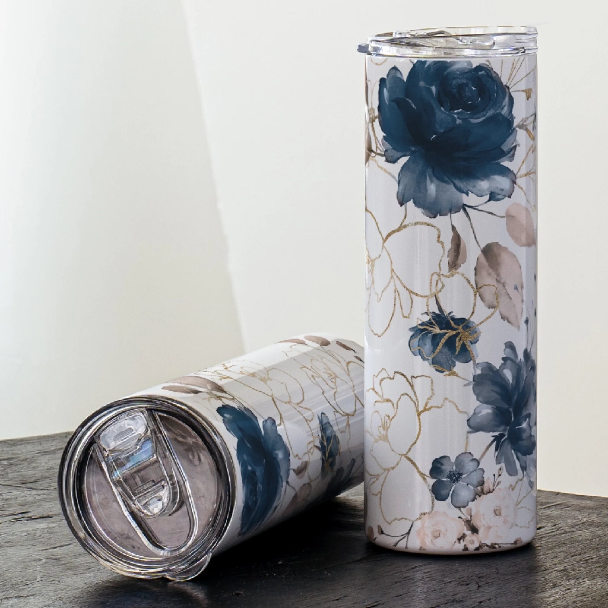 blue floral tumbler with white and gold accents