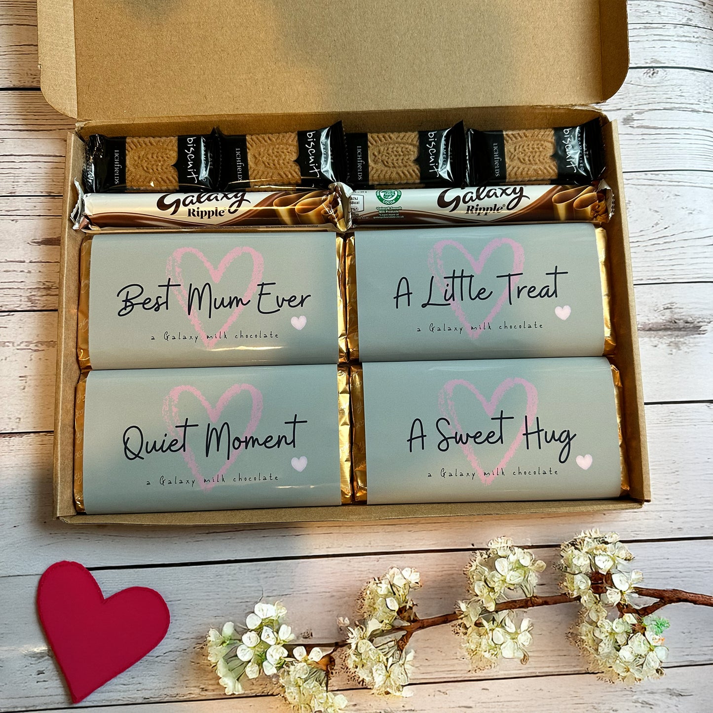 chocolate treat for mum - box of Galaxy chocolate bars with personalised messages on a wooden surface.