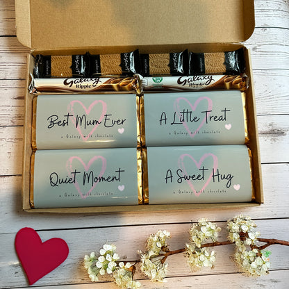 chocolate treat for mum - box of Galaxy chocolate bars with personalised messages on a wooden surface.