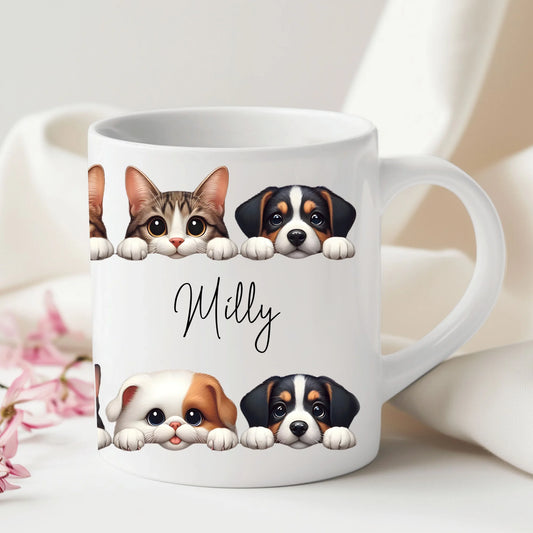 White mug with illustrations of a cat, two dogs, and the name 'Milly' on a light background.