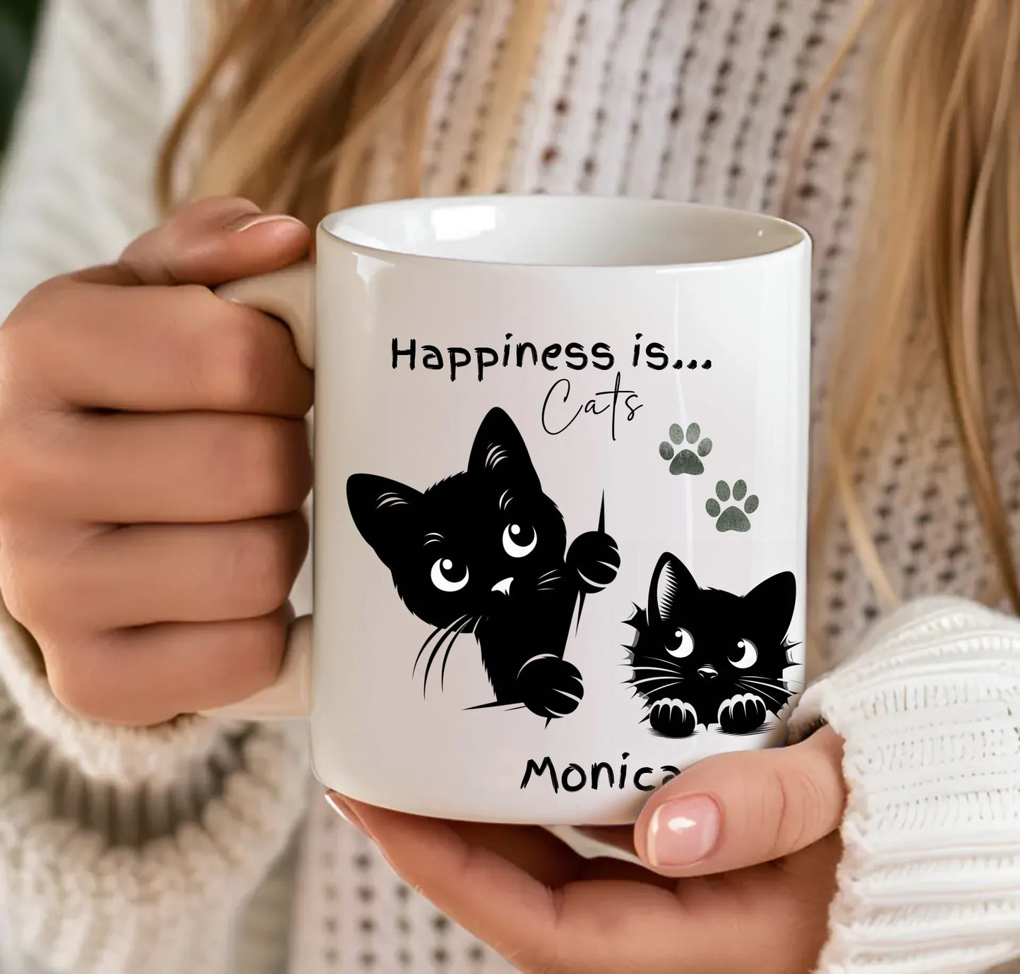 black cat peeking mug