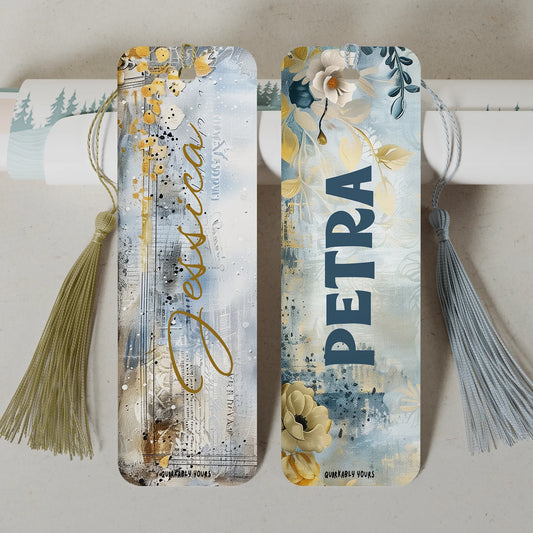 Two decorative bookmarks with floral designs and tassels on a light background