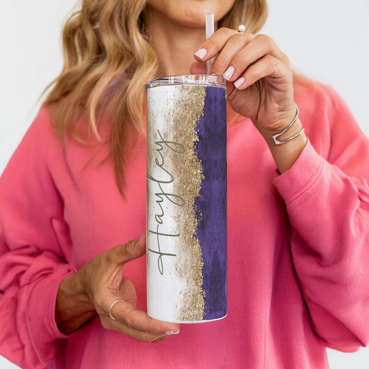 Person holding a tumbler with a Purple glitter design and 'Hayley' branding.