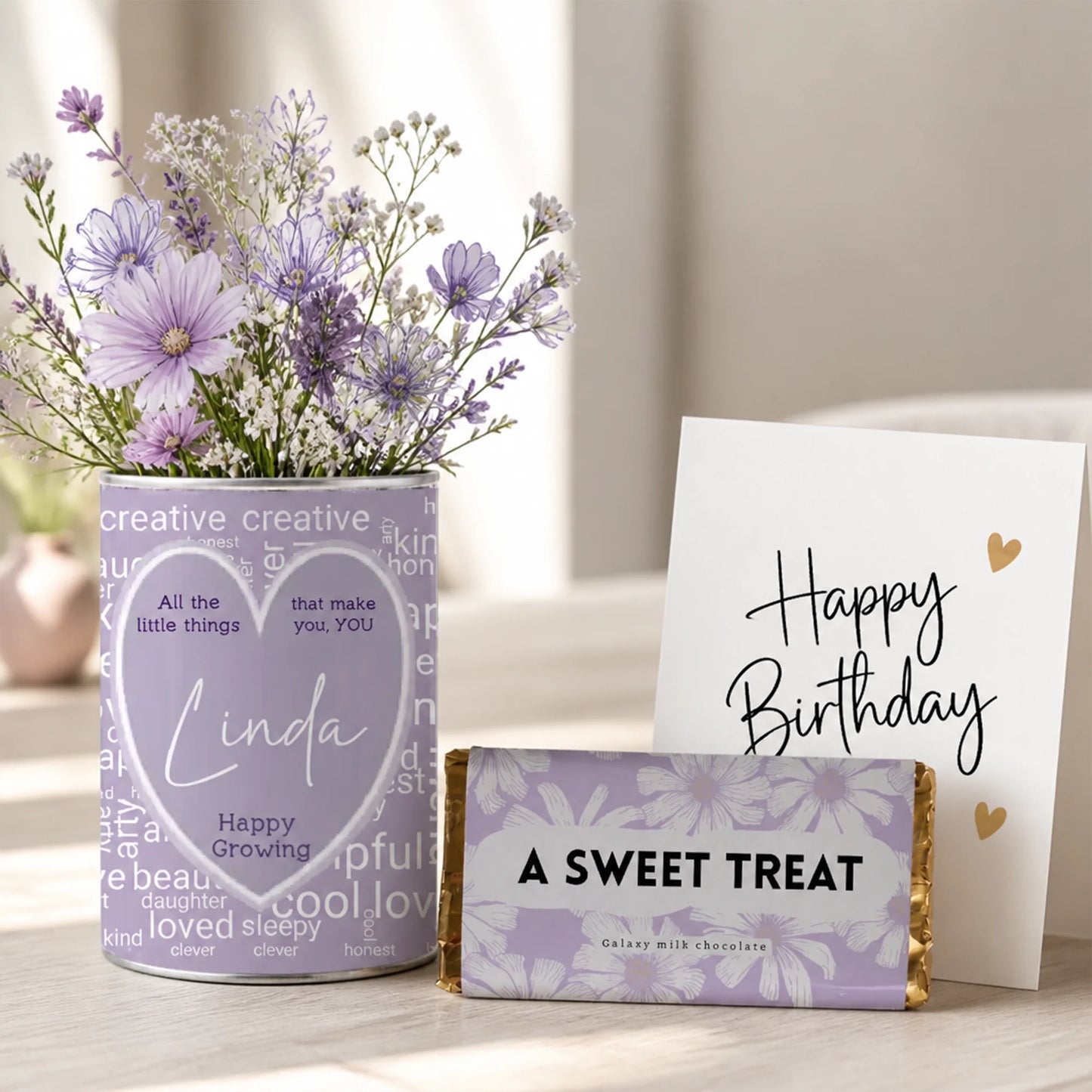 Personalised grow tin with heart-shaped name label and word cloud made from 25 inspiration words