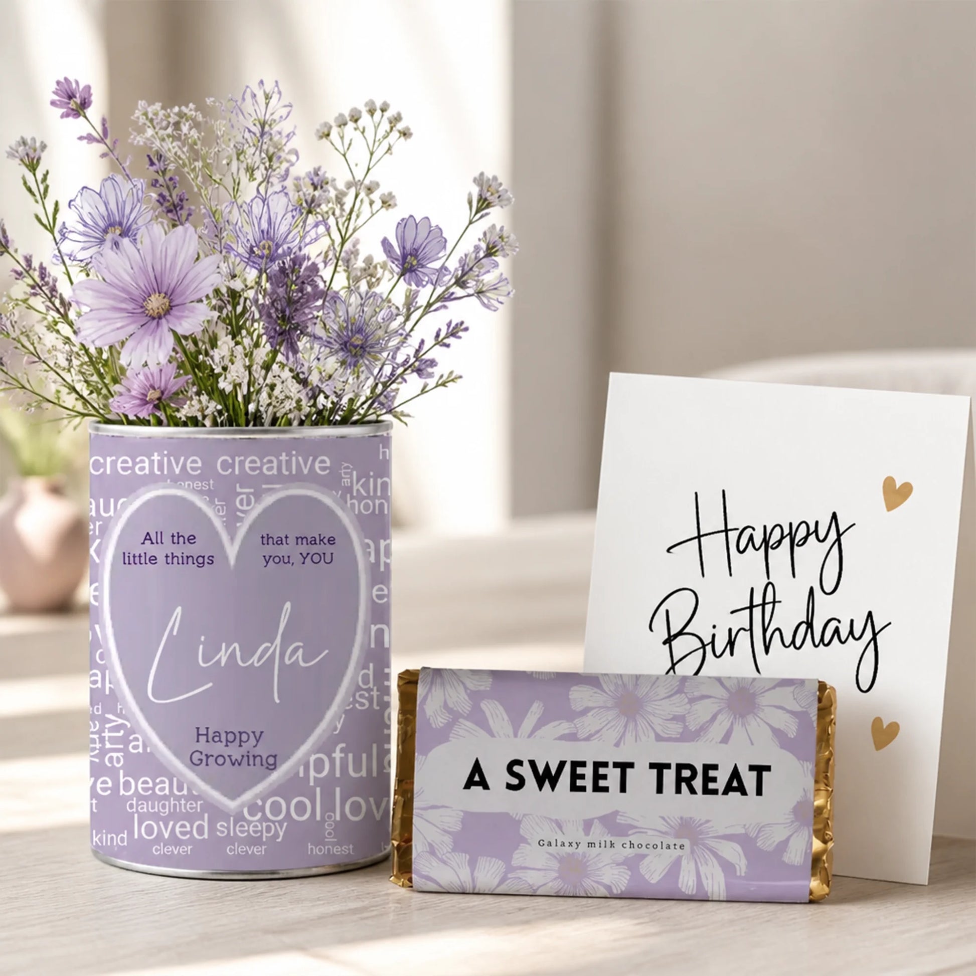 Personalised grow tin with heart-shaped name label and word cloud made from 25 inspiration words