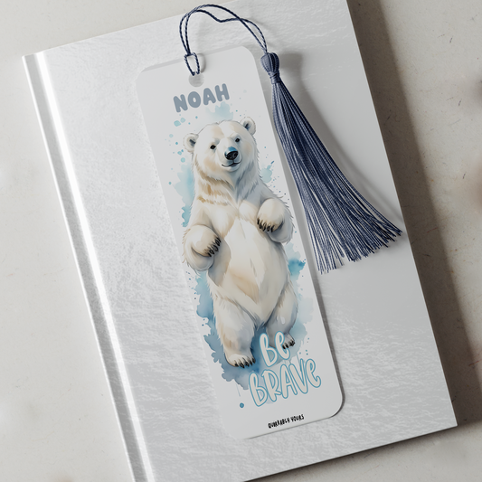Bookmark with polar bear illustration and 'Be Brave' text on a notebook