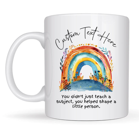 White mug with a colorful rainbow design and customizable text on a white background