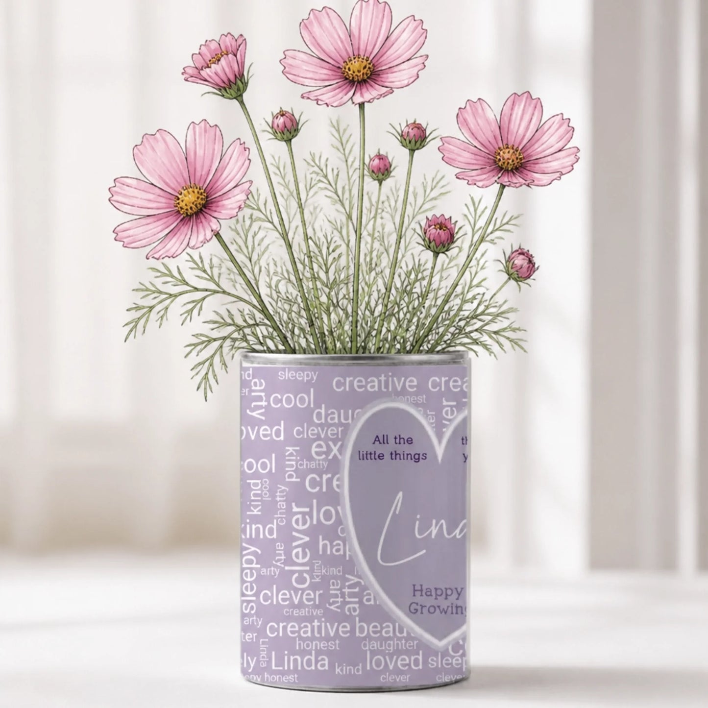 Personalised word cloud grow tin with name and 25 inspiration words, filled with wildflower seeds