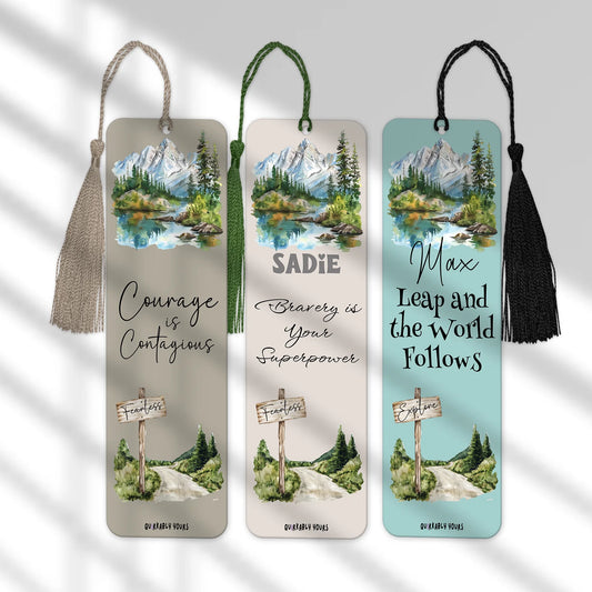 Three bookmarks with scenic designs and motivational quotes on a light gray background.