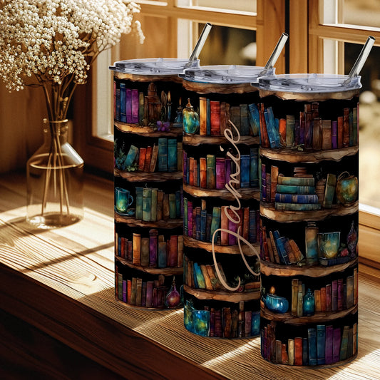 Three tumblers with bookshelf design and 'Jamie' text on a wooden surface.
